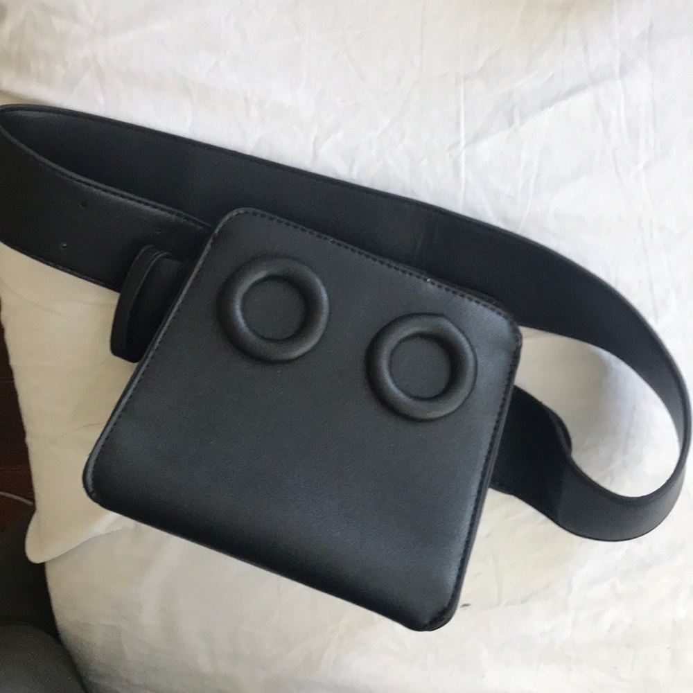 Faux leather grommet boy bag look alike